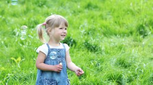 little girl with soap bubbles