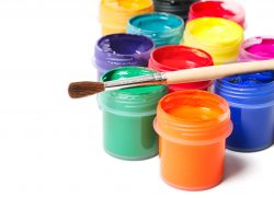 Multicolor paints and paintbrush on white background