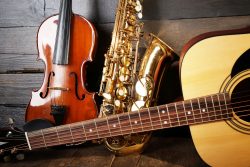 Close up view on musical instruments on wooden background